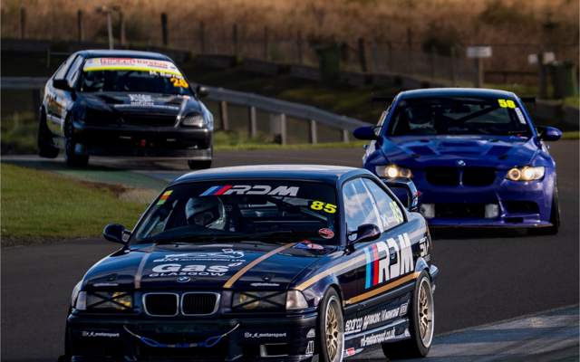 RDM's E36 race car, number 85, leading on track